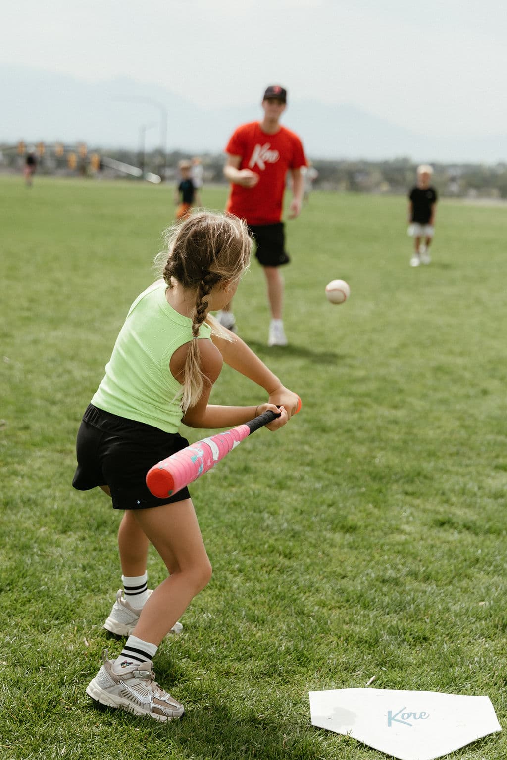 Kid swinging a bat